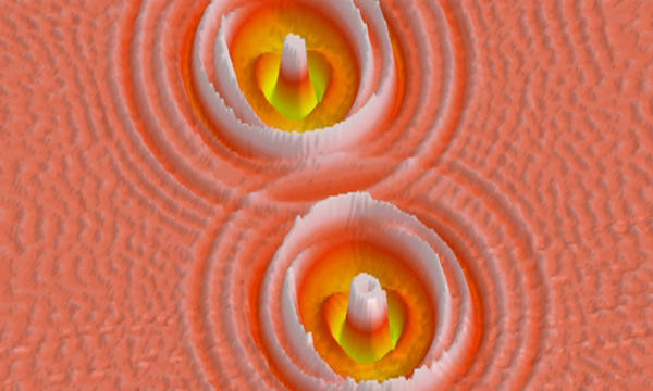 orange patterned background with two candy corn-looking peaks and whiter ridges around the peaks