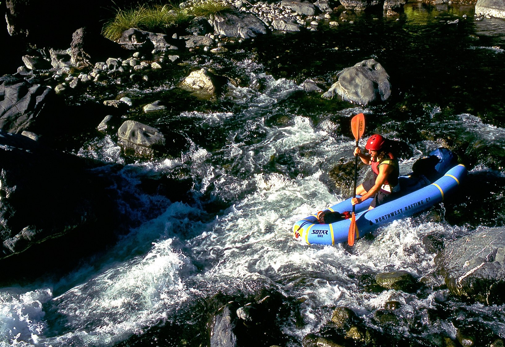 A photo of a kayaker on the Chetco River - Rogue River-Siskiyou National Forest.