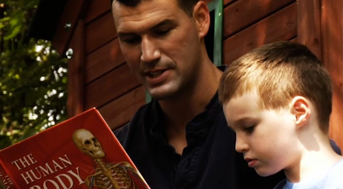 Josh reads to his son