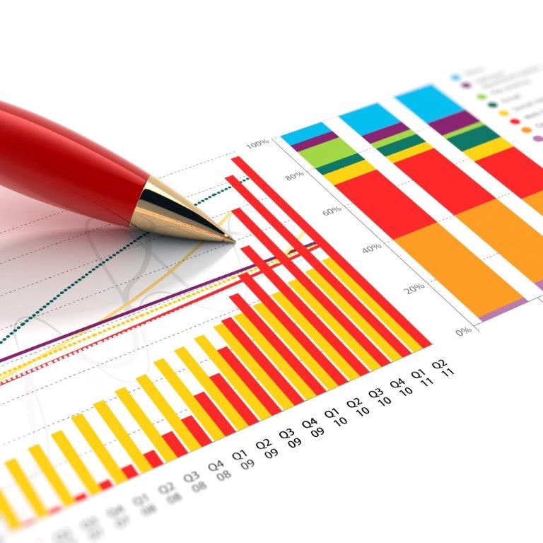 Image of pen reviewing statsitics on paper