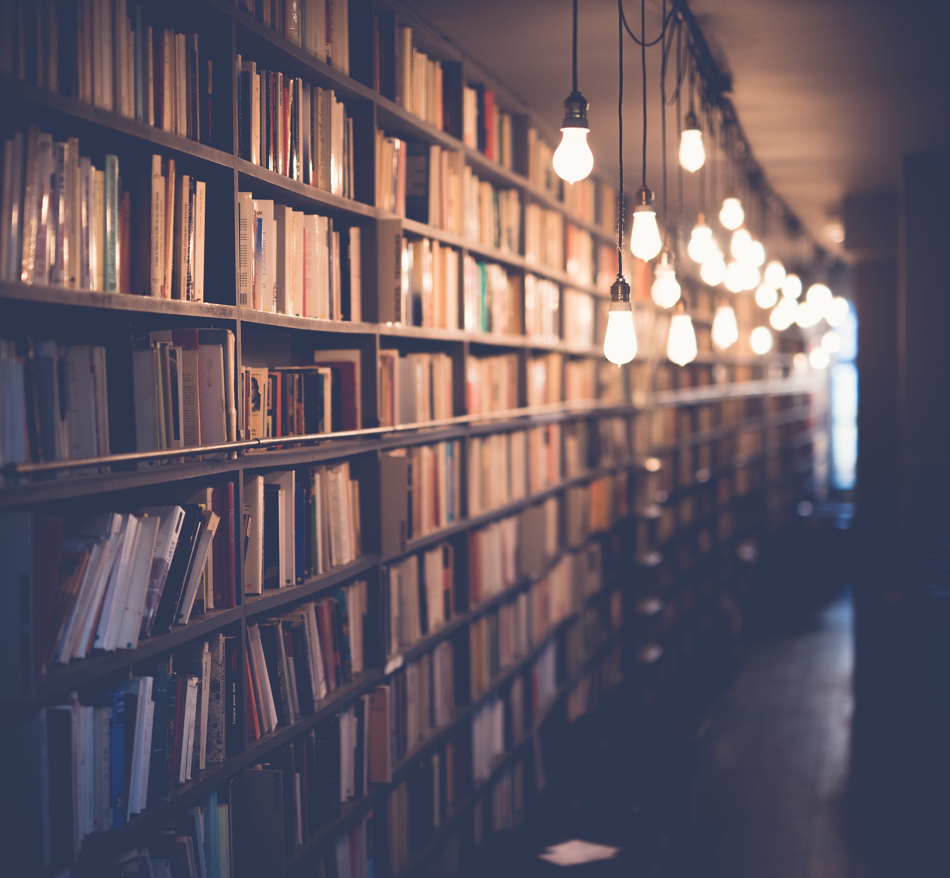 Books on a shelf in a hallway