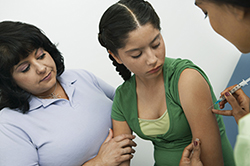 Child receiving an HPV vaccine.