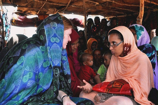 Assistant Secretary for Population, Refugees, and Migration Anne C. Richard confers with Malian refugees at the Damba Camp. (August 2012)