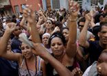 Date: 12/10/2009 Description: Cuba's government's supporters shout slogans in favor of Cuban leader Fidel Castro during a march organized by dissidents to commemorate the Human Rights Day in Havana, Thursday, Dec. 10, 2009. © AP Image