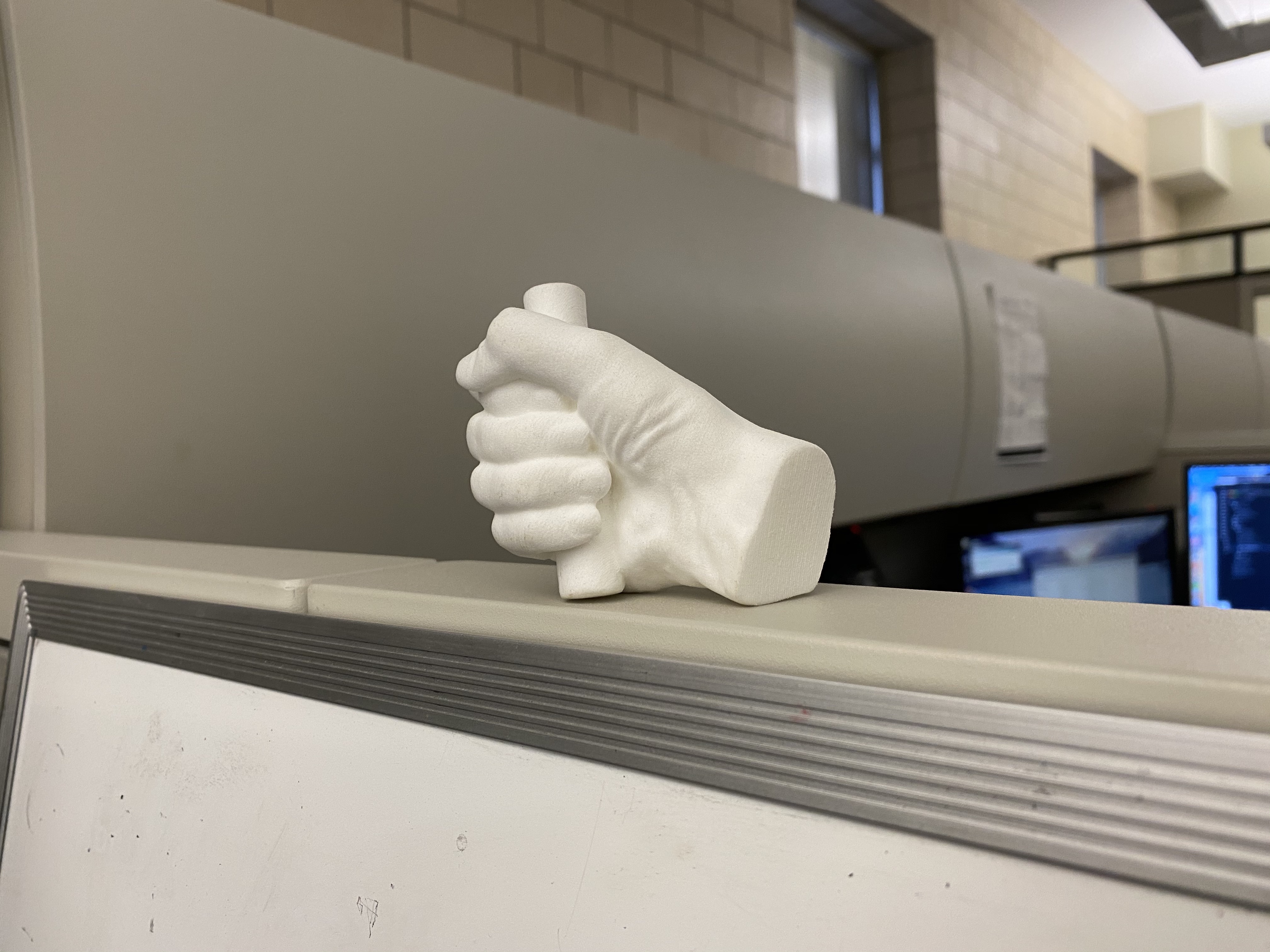 A 3D print of Lincoln's hand made from the digital model created by staff. 