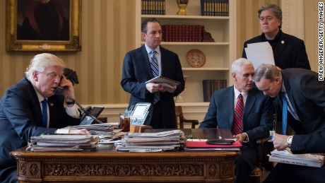 WASHINGTON, DC - JANUARY 28: President Donald Trump speaks on the phone with Russian President Vladimir Putin in the Oval Office of the White House, January 28, 2017 in Washington, DC. Also pictured, from left, White House Chief of Staff Reince Priebus, Vice President Mike Pence, White House Chief Strategist Steve Bannon, and Press Secretary Sean Spicer. On Saturday, President Trump is making several phone calls with world leaders from Japan, Germany, Russia, France and Australia. (Photo by Drew Angerer/Getty Images)