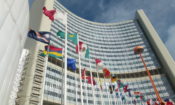 View of a modern office building with international flags in front