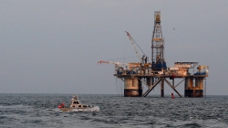 October 13, 2020: Launch Boat 2904 from the NOAA Ship Thomas Jefferson conducts a hydrographic survey of the Calcasieu Ship Channel in Louisiana to search for navigational hazards after Hurricane Delta came through the area. An offshore oil platform in the background.