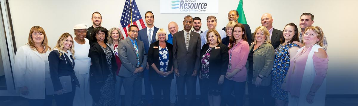 Photograph of Secretary Dr. Ben Carson and twenty others at the Spokane Resource Center
