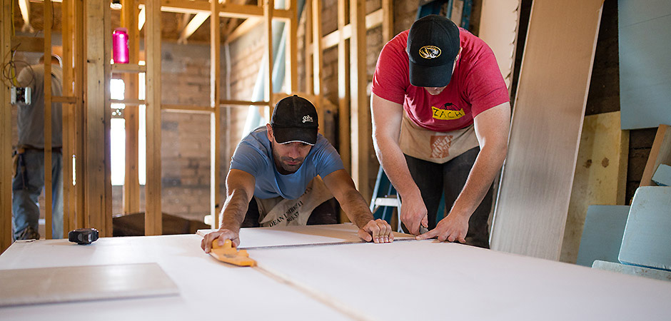 Employees volunteering to build a Habitat for Humanity house