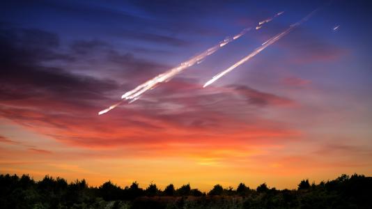 Artist’s representation of meteorites falling to Earth. A team of researchers recently shed light on how meteorite strikes may affect quartz, one of the most abundant materials in the Earth’s crust. (Image by Shutterstock/Triff/NASA.)