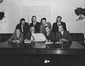 Commerce staffers looking at daily headlines. 1941