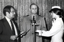 Commerce Secretary Peter G. Peterson swears in the first woman officer of the National Oceanic and Atmospheric Administration's Commisioned Corp