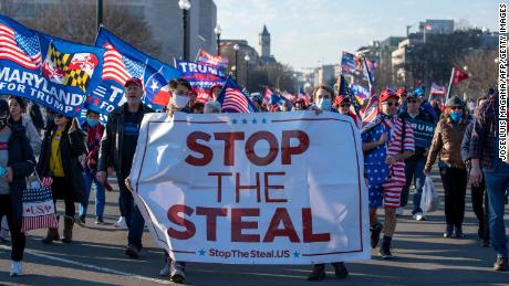 Supporters of US President Donald Trump march on Pennsylvania Avenue to protest the outcome of the 2020 presidential election on December 12, 2020 in Washington, DC.