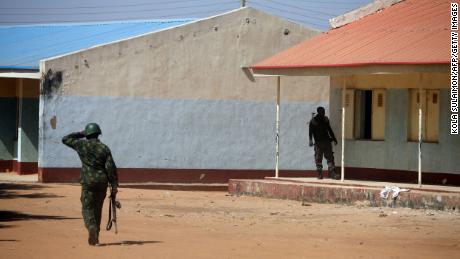 NIgerian soldiers walk inside the Government Science where gunmen abducted students in Kankara, in northwestern Katsina state, Nigeria December 15, 2020. - Boko Haram on Tuesday claimed the abduction of hundreds of students, marking its first attack in northwestern Nigeria since the jihadist uprising began more than ten years ago. (Photo by Kola Sulaimon / AFP) (Photo by KOLA SULAIMON/AFP via Getty Images)