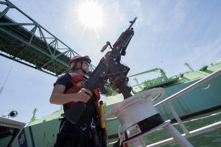 A 3rd Class Petty Officer, a crewmember of Coast Guard Station Boston, is
underway aboard a 45-foot response boat during a security escort in Boston
Harbor. The station's crew escorted the Norwegian-flagged LNG (liquefied natural gas) tanker BW GDF
SUEZ Boston into a terminal in Boston. (U.S. Coast Guard photo by Petty
Officer 2nd Class Cynthia Oldham)