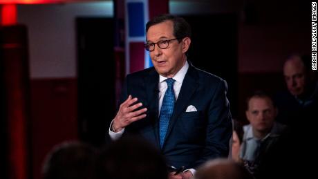 Fox News Channel&#39;s Chris Wallace, right, asks South Bend, Indiana Mayor Pete Buttigieg a question during a town hall with Fox News Channel on May 18, 2019 in Claremont, New Hampshire. Buttigieg, one of 23 Democrats seeking the 2020 presidential nomination, pitched four distinct tax hikes at the event when asked about the deficit.