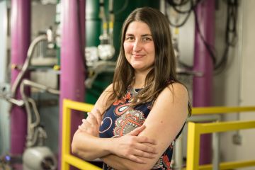 Leah Broussard leads a study of neutron decay to understand correlations between electrons and antineutrinos as well as subtle distortions in the electron energy spectrum. The physicist, who hails from Louisiana, influenced the color scheme of the experiment’s newly installed instrument to reflect her home state’s biggest celebration—its spectrometer sports Mardi Gras green on the magnet, purple on the shielding, and gold inside the magnet and on safety bars. Credit: Genevieve Martin/Oak Ridge National Labo