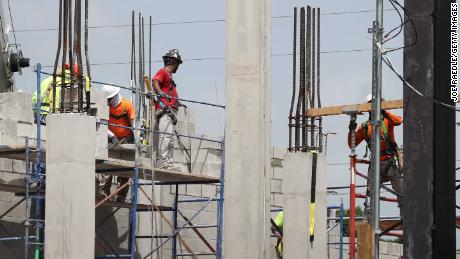 MIAMI, FLORIDA - SEPTEMBER 04: Construction workers are seen on a job site on September 04, 2020 in Miami, Florida. The Bureau of Labor Statistics released a report today that shows the unemployment rate fell to 8.4 percent last month, down from a COVID-19 pandemic peak of 14.7 percent in April. (Photo by Joe Raedle/Getty Images)