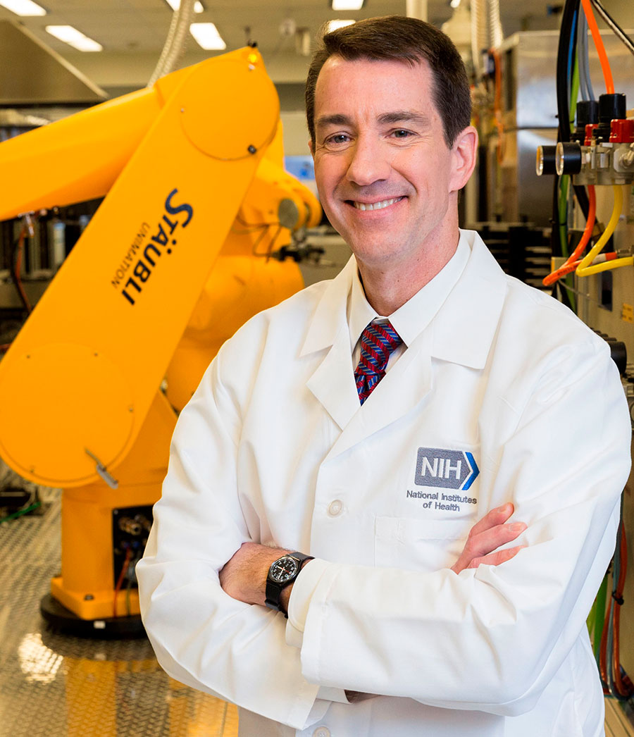 Dr. Christopher Austin with robot