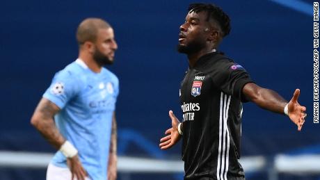 Lyon&#39;s Ivorian forward Maxwel Cornet celebrates his goal during the UEFA Champions League quarter-final football match between Manchester City and Lyon at the Jose Alvalade stadium in Lisbon on August 15, 2020. (Photo by FRANCK FIFE / POOL / AFP) (Photo by FRANCK FIFE/POOL/AFP via Getty Images)