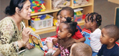 Teacher reading to children