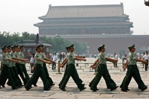 Chinese soldiers pass a sqare at the entrance to the Forbidden City in Beijing on Wednesday, August 16, 2006. Original construction of the Forbidden City began in 1406 AD requiring an estimated 3 million workers and the costs nearly bankrupted the Ming Dynasty under its third emperor Zhu Di. (KEYSTONE/Alessandro Della Bella) === , ===