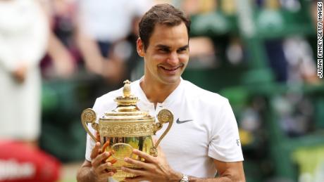 LONDON, ENGLAND - JULY 16:  Roger Federer of Switzerland celebrates victory with the trophy after the Gentlemen&#39;s Singles final against  Marin Cilic of Croatia on day thirteen of the Wimbledon Lawn Tennis Championships at the All England Lawn Tennis and Croquet Club at Wimbledon on July 16, 2017 in London, England.  (Photo by Julian Finney/Getty Images)