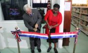 Man and Woman cutting ribbon