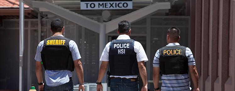 Agents walking toward the Mexico border