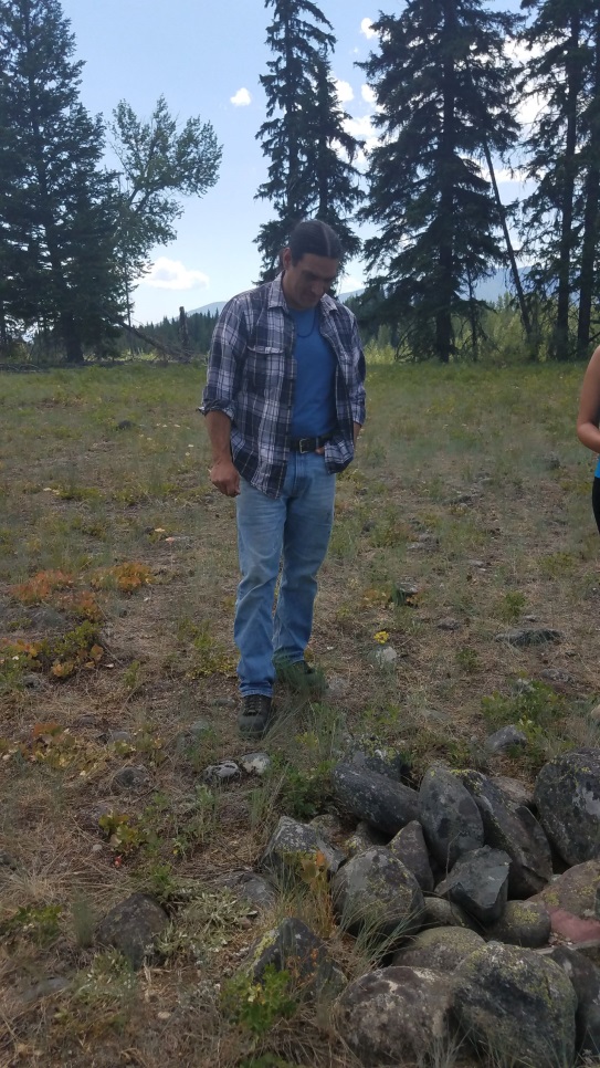 THPP student viewing a rock cairn