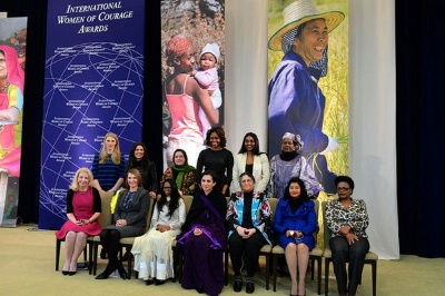 First Lady Michelle Obama, Deputy Secretary Heather Higginbottom, and U.S. Ambassador-at-Large for Global Women's Issues Catherine Russell pose for a photo with the 2014 Secretary of State's International Women of Courage Awardees at the U.S. Department of State in Washington, D.C., on March 4, 2014. [State Department photo/ Public Domain]