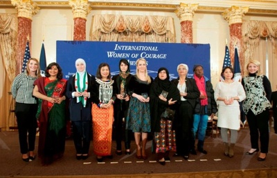 Deputy Secretary Heather Higginbottom and U.S. Ambassador-at-Large for Global Women's Issues Cathy Russell pose for a photo with the 2015 Secretary of State's International Women of Courage Awardees at the U.S. Department of State in Washington, D.C. 