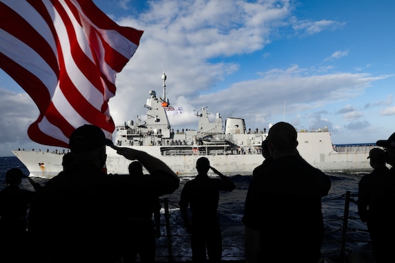 201209-N-MQ703-1091 PACIFIC OCEAN (Dec. 9, 2020) Sailors aboard the arleigh-burke class guided-missile destroyer USS Michael Murphy (DDG 112) render honors to HMNZS Te Kaha (F77), an Anzac-class frigate from the Royal New Zealand Navy. Te Kaha and Michael Murphy conducted combined operations in the eastern Pacific, December 8 through 9.