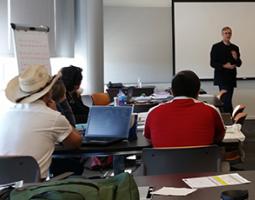 Facilitators listening to a NASA atmospheric scientist during the GLOBE training workshop