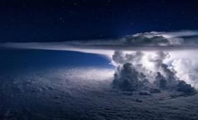 Clouds at night illuminated from behind