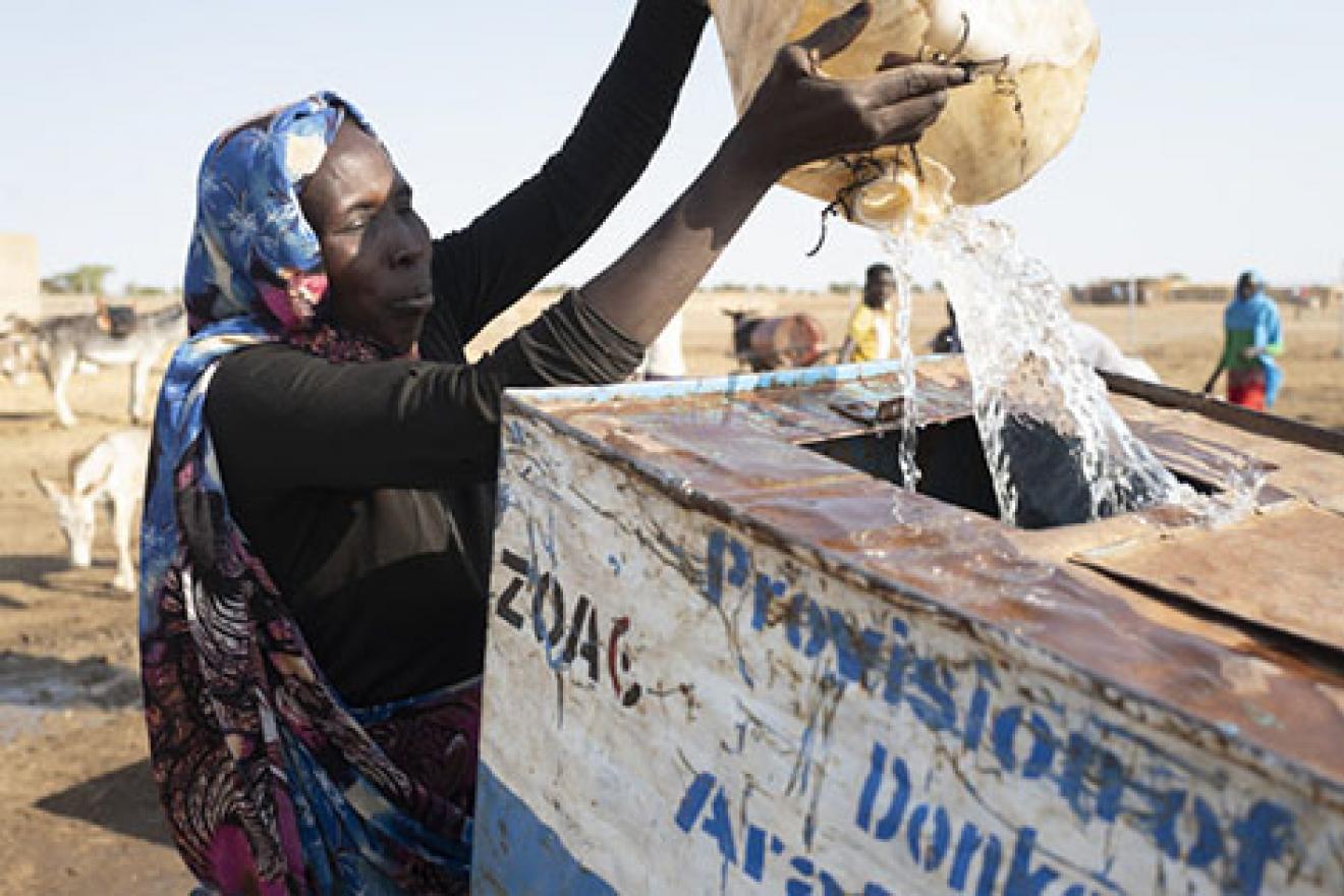 woman pouring out water