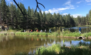 Hear of Oregon AmeriCorps members hike through the Deschutes National Forest for a team building exercise in May.
