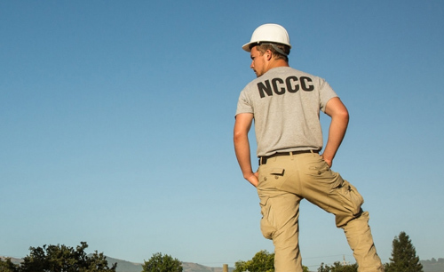 AmeriCorps NCCC member looking at view under blue sky