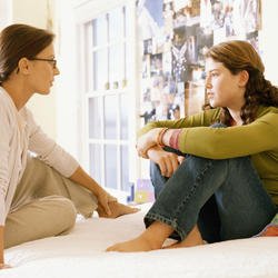 Mother and teen daughter talking