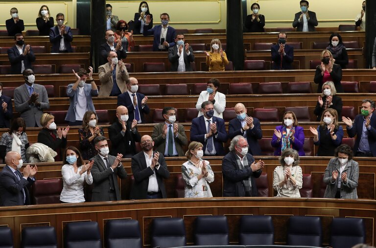 Members of Spain’s ruling party celebrate the passage in the lower house of Parliament of a bill decriminalizing euthanasia on Thursday.