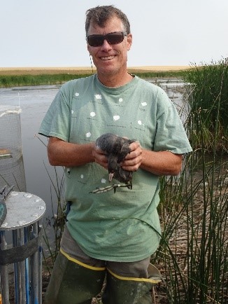 Man holding duck USFWS