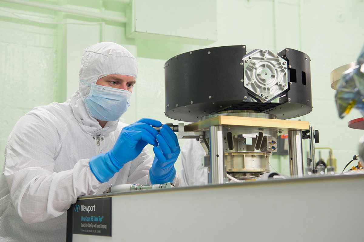 NASA technician, Wes Fincher, installs a temporary vibration sensor