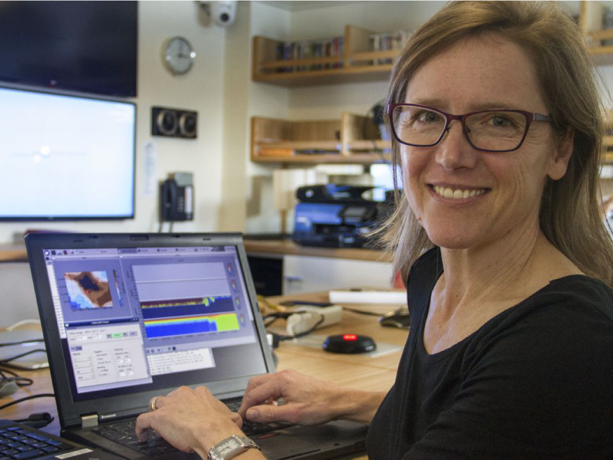 Stephanie Schollaert Uz monitors the speed and direction of water flowing under the ship