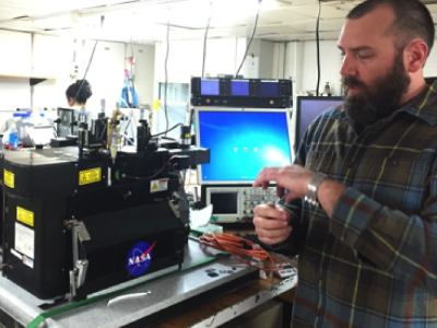 Jason Graff (OSU) measures the carbon in phytoplankton and sorts species with a laser-based instrument. Credit: Stephanie Schollaert Uz (NASA)