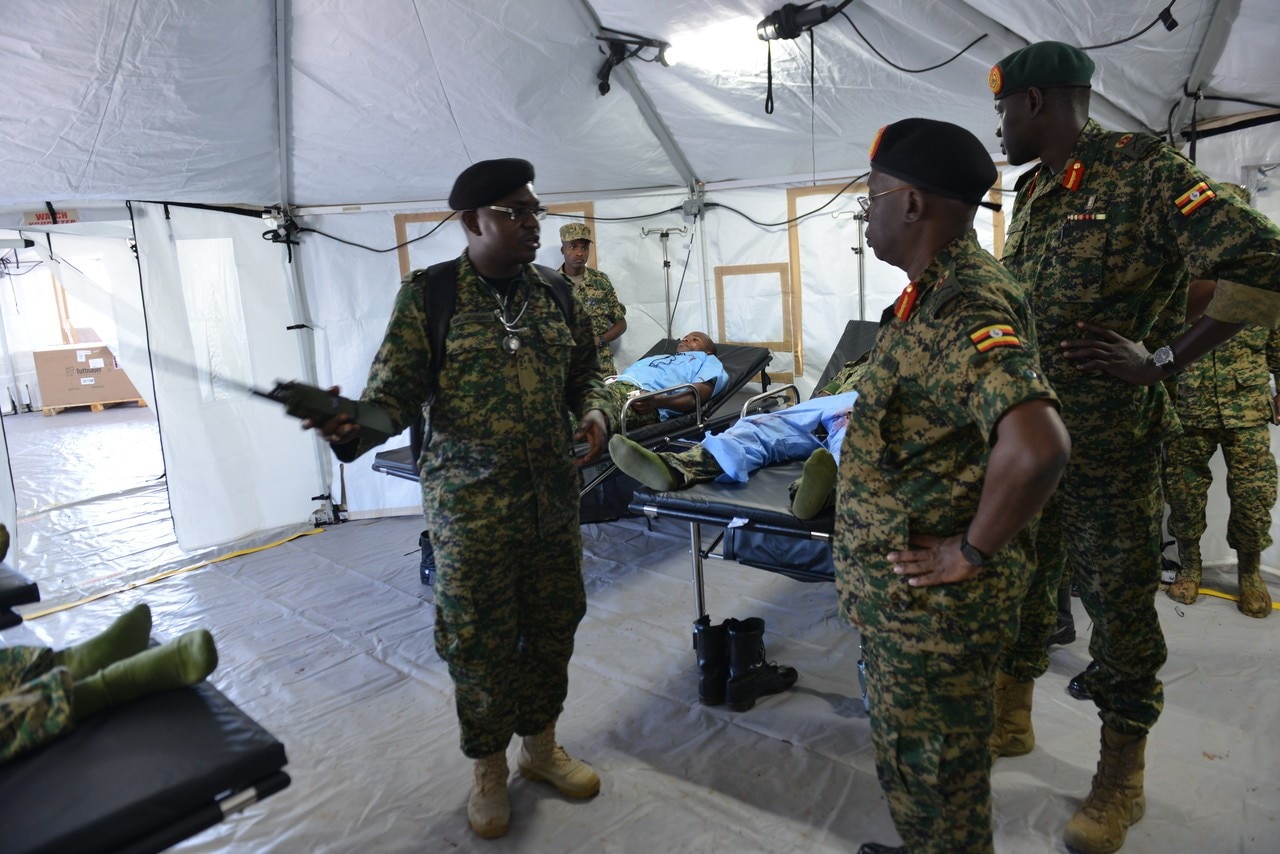 Uganda Peoples' Defence Force medical staff briefs senior officers on the layout of a U.S.-provided United Nations-standard Level 2 expeditionary hospital facility at the Uganda Rapid Deployment Capabilities Center in Jinja, Uganda during a 2019 demonstration (Photo courtesy of U.S. AFRICOM)