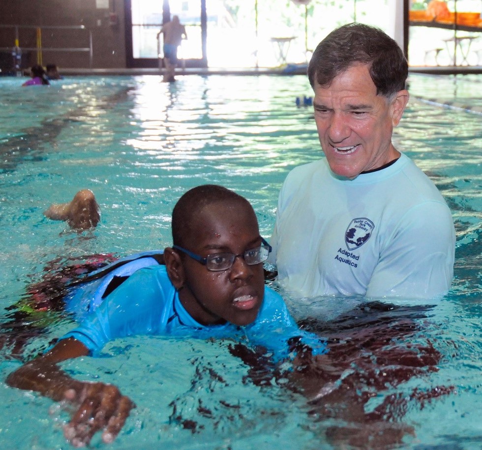 Ken Kozloff helps youth learn to swim with Adapted Aquatics