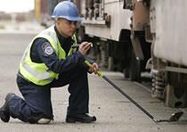 CBP Officer Inspecting Rail Cars