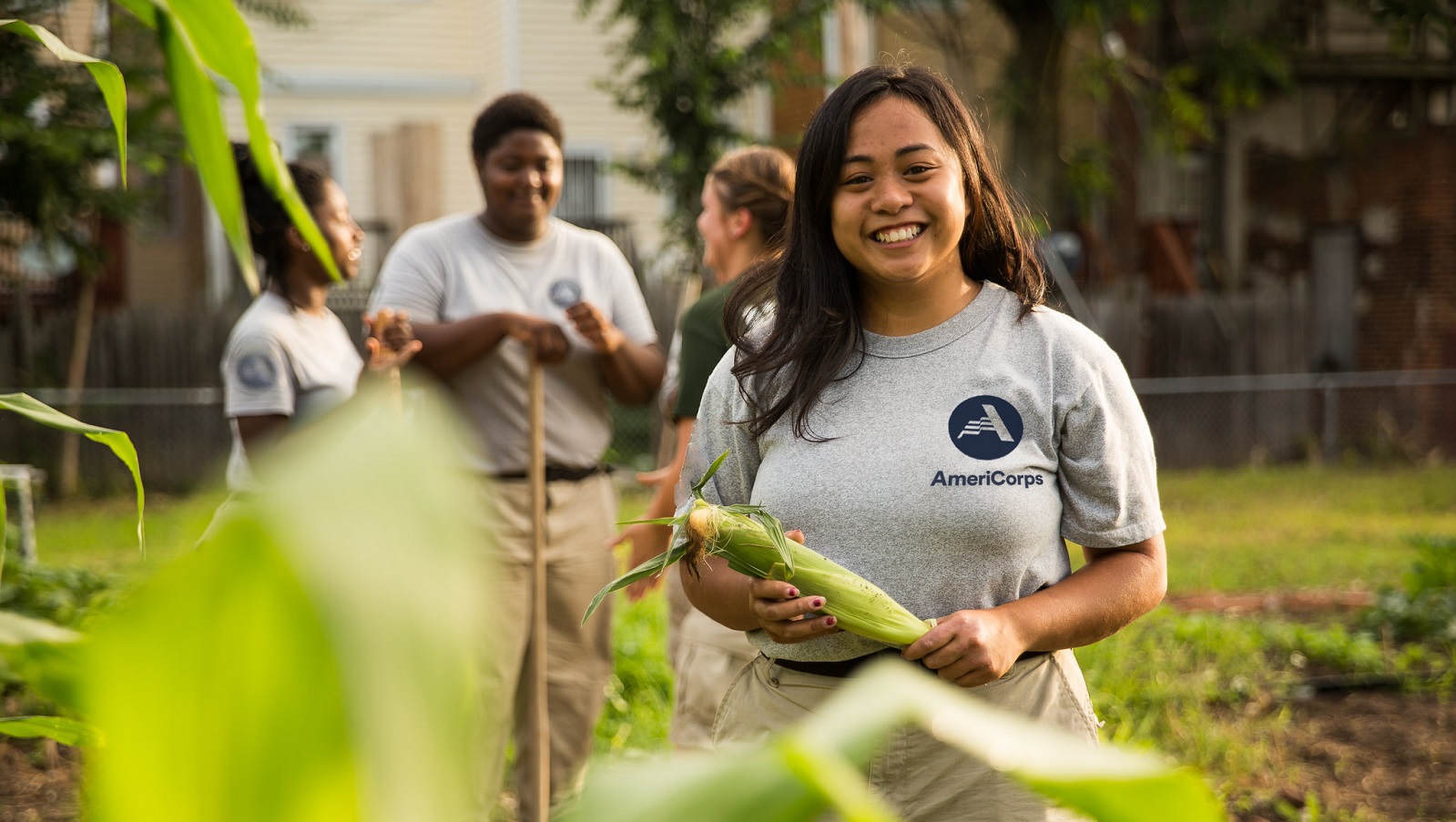 Team of AmeriCorps members serve in community garden