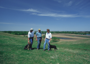 NRCS conservationists working with a landowner in eastern South Dakota.